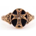 Victorian black enamel and diamond set mourning ring, the oval panel engraved with a central cross