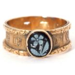 Antique mourning ring, the top section applied with a hardstone forget me not panel, raised