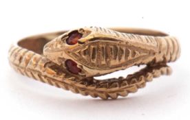 9ct gold serpent ring, the head highlighted with two coloured paste eyes, the coiled body chased and