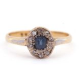 Sapphire and diamond cluster ring, the cushion shaped sapphire surrounded by ten small old cut