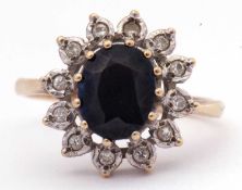 9ct gold sapphire and diamond cluster ring, the oval faceted sapphire 8 x 5mm, multi-claw set and