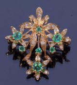 9ct gold hallmarked emerald and diamond brooch/pendant, a floral garland open work design