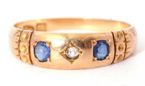 Victorian 18ct gold sapphire and diamond three stone ring centring a small round cut diamond flanked