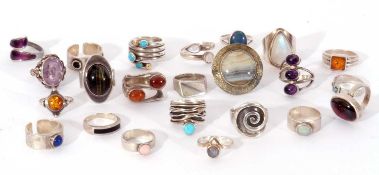 Mixed white metal modern rings to include opal, turquoise, amber and moonstone examples, g/w 135gms,