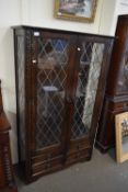 LEAD GLAZED BOOKCASE CABINET WITH FOUR DRAWER BASE