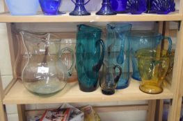 VARIOUS COLOURED GLASS JUGS