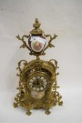 CONTINENTAL BRASS CASED AND PORCELAIN MOUNTED MANTEL CLOCK