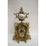 CONTINENTAL BRASS CASED AND PORCELAIN MOUNTED MANTEL CLOCK