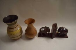 PAIR OF HARDWOOD BOOKENDS FORMED AS ELEPHANTS, TURNED WOODEN VASE AND A FURTHER GERMAN POTTERY