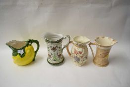 FOUR VARIOUS DECORATED JUGS