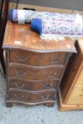 REPRODUCTION SMALL SERPENTINE FRONT MAHOGANY VENEERED FOUR DRAWER CHEST, 49CM WIDE