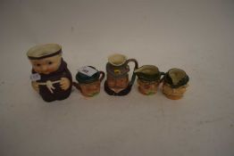 FIVE MINIATURE CHARACTER JUGS