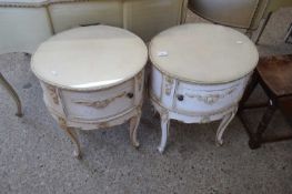 PAIR OF CONTINENTAL OVAL FORMED BEDSIDE CABINETS WITH CABRIOLE LEGS AND GILT PAINTED DETAIL ON A