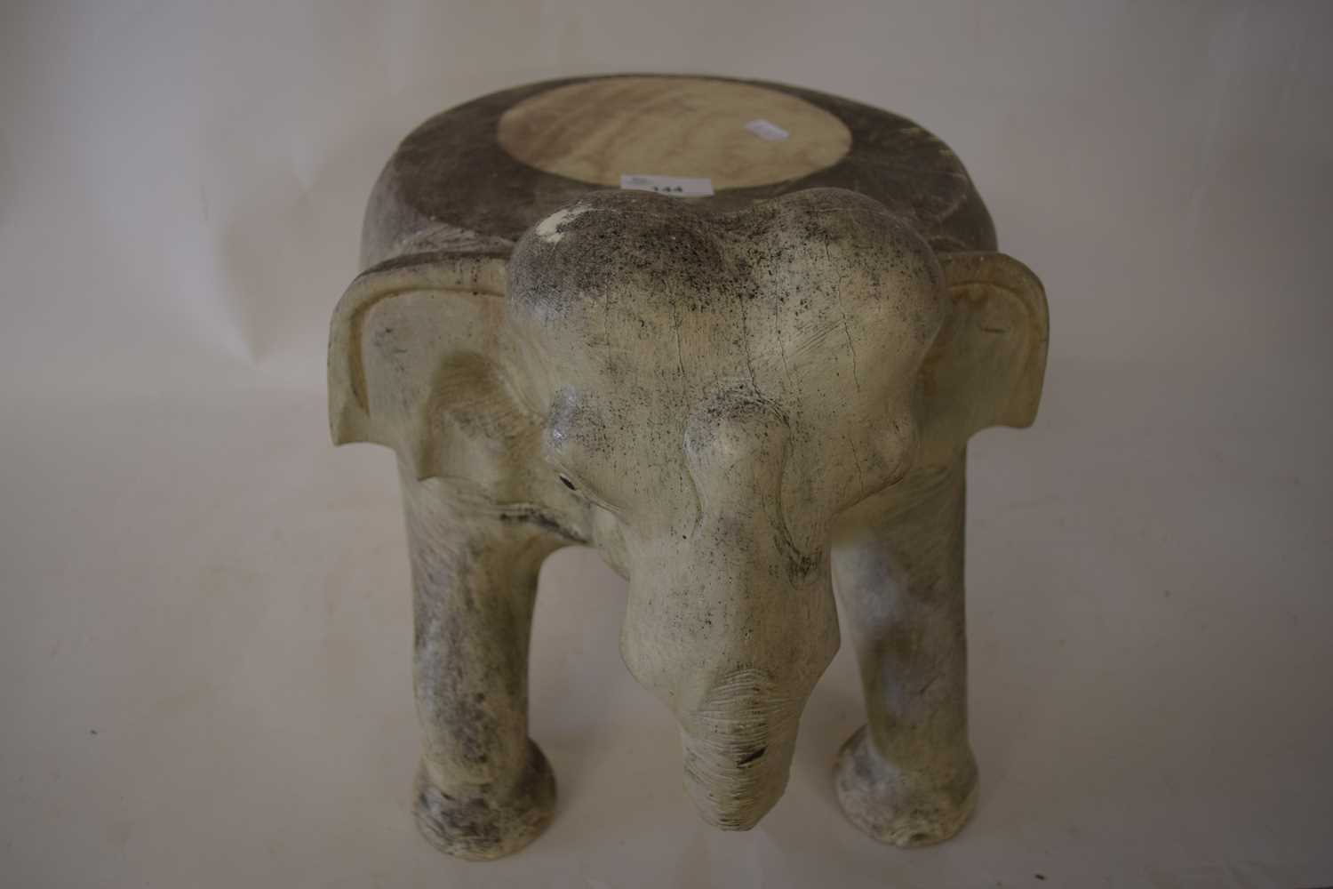 SMALL STOOL FORMED AS AN ELEPHANT