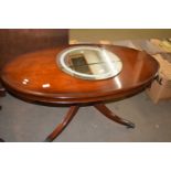 OVAL MAHOGANY VENEERED COFFEE TABLE