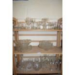 LARGE MIXED LOT OF DRINKING GLASSES, GLASS BOWLS ETC (3 SHELVES)