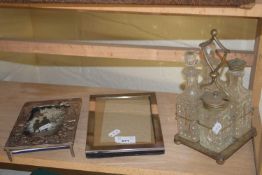 CRUET IN SILVER PLATED FRAME, PLUS TWO FURTHER SILVER PLATED PICTURE FRAMES