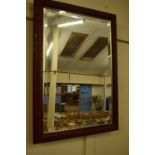 20TH CENTURY RECTANGULAR BEVELLED WALL MIRROR IN A FOLIATE FINISH FRAME