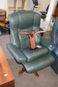 GREEN LEATHER ARMCHAIR AND ACCOMPANYING FOOT STOOL
