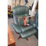 GREEN LEATHER ARMCHAIR AND ACCOMPANYING FOOT STOOL