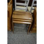 NEST OF THREE MAHOGANY VENEERED AND INLAID OCCASIONAL TABLES