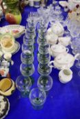 QUANTITY OF GREEN STEMMED WINE GLASSES