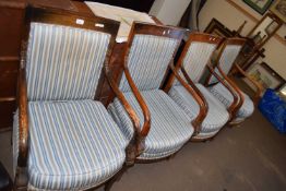 SET OF FOUR 20TH CENTURY GEORGIAN STYLE ARMCHAIRS, THE ARMS CARVED WITH DOLPHIN DECORATION