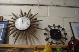 TWO MID-CENTURY WALL CLOCKS, ONE WITH STAR OR SUNBURST DECORATION