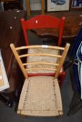 RED RUSH SEATED CHAIR PLUS A FURTHER LADDERBACK CHAIR (2)