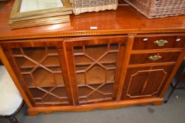 REPRODUCTION YEW WOOD VENEERED SIDE CABINET WITH GLAZED DOORS, FURTHER PANELLED DOOR AND TWO