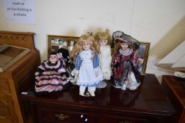 FIVE MODERN PORCELAIN HEADED DOLLS