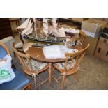 CIRCULAR KITCHEN TABLE AND FOUR STICK BACK CHAIRS