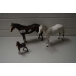 TWO BESWICK HORSES AND A FOAL (A/F)