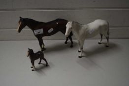 TWO BESWICK HORSES AND A FOAL (A/F)