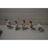 FIVE VARIOUS NAPLES/CAPO DI MONTE MODELS OF MUSICAL CHERUBS