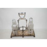 SILVER PLATED SPIRIT DECANTER STAND AND TWO DECANTERS