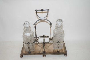 SILVER PLATED SPIRIT DECANTER STAND AND TWO DECANTERS