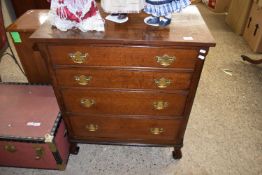 20TH CENTURY OAK FOUR DRAWER CHEST FITTED WITH BRASS HANDLES, THE SECOND DRAWER FITTED AS A