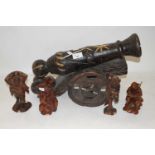 WOODEN MODEL CANNON TOGETHER WITH FOUR VARIOUS CHINESE WOODEN FIGURES (5)
