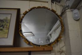 EARLY 20TH CENTURY CIRCULAR BEVELLED WALL MIRROR WITH A GILT FLORAL SURROUND 53CM D