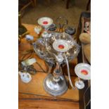 SILVER PLATED CAKE BASKET, SILVER PLATED CANDELABRA AND A SILVER PLATED BOTTLE STAND (3)