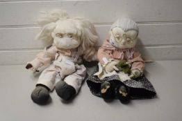 PAIR OF DOLLS MODELLED AS AN ELDERLY COUPLE