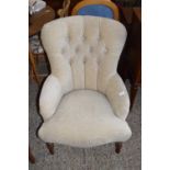 BEIGE UPHOLSTERED BUTTON BACK ARMCHAIR