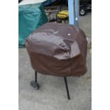 Small charcoal barbecue/smoker with cover
