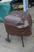 Small charcoal barbecue/smoker with cover