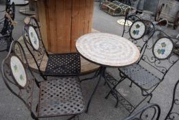 Garden bistro set comprising a table and four folding metal chairs