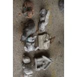 Seven small composite statues/ornaments to include gnome, pigs etc