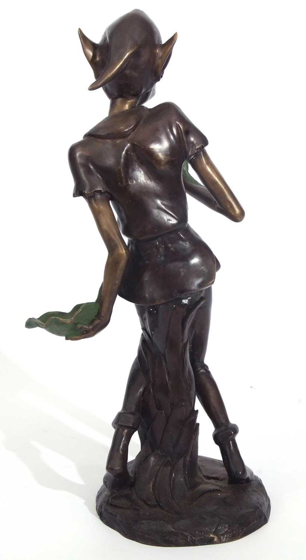 A contemporary bronzed metal model of a pixie holding two leaves, set on a circular base, 77cm high - Image 2 of 2