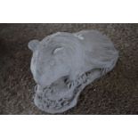 Composite garden ornament formed as a guinea pig, width approx 35cm