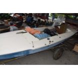 Sailing dinghy, length approx 490cm including accompanying sails, rudders etc, on a trailer